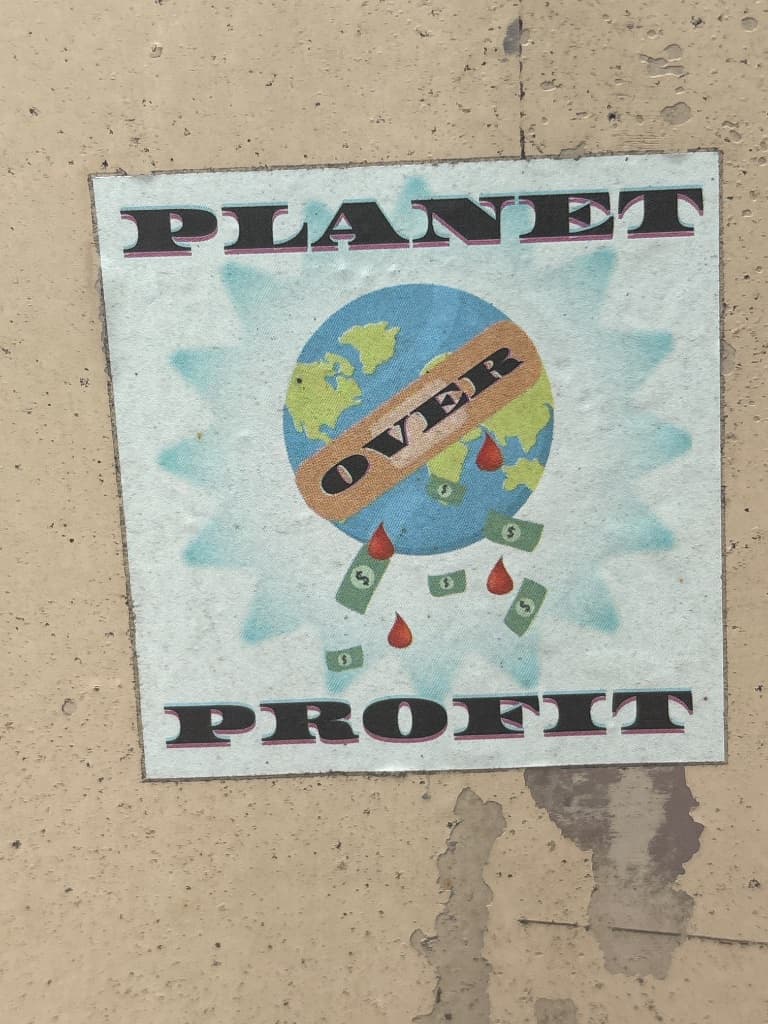 Planet over Profit sticker in The Hague